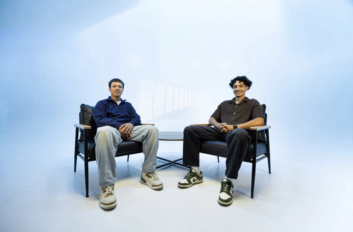 EJ Miller and Asher Fenton-Young seated side by side in the studio